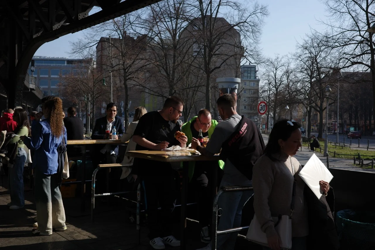 _The very first Burgermeister spot of Berlin being illuminated by beautiful sunlight as people gather and eat together.
